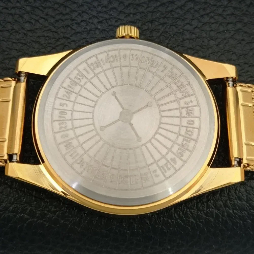 Vintage 1970 Roulette Manual Mens Gold Watch W/Steel Strap & Green accents